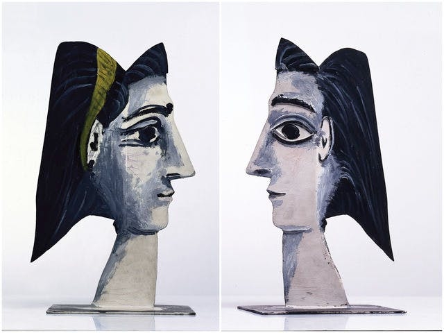 Picture of the sculpture Jacqueline au ruban jaune by Pablo Picasso. The Picture shows two sides of the sculpture which portrays a woman's face on one side with a yellow ribbon.