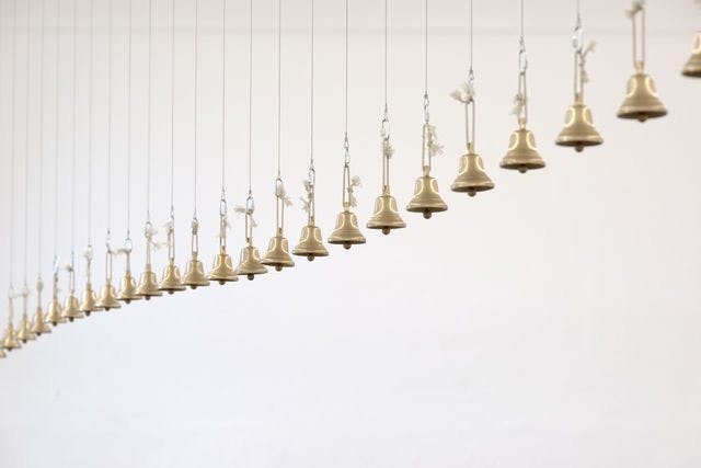 Picture of bronze bells, artwork by David Horvitz