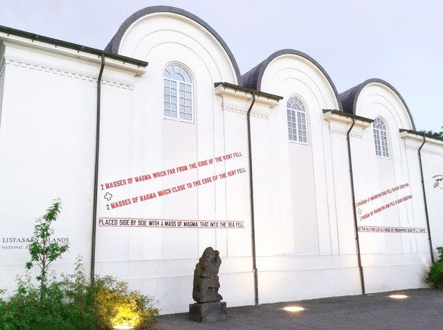 Picture of The National Gallery of Iceland at Fríkirkjuvegur where bands of text by Lawrence Weiner have been placed on the building.